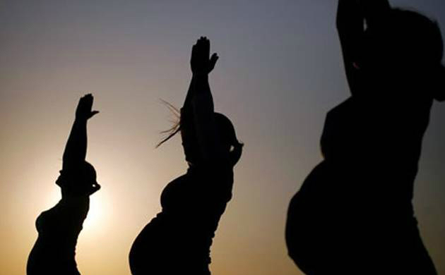 Pregnant Women in Yoga Pose